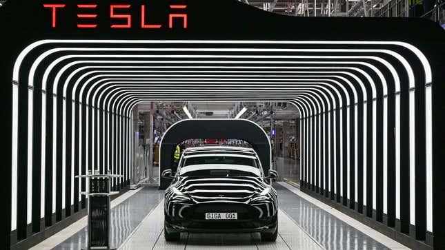 Image of a Tesla car rolling off the production line. 